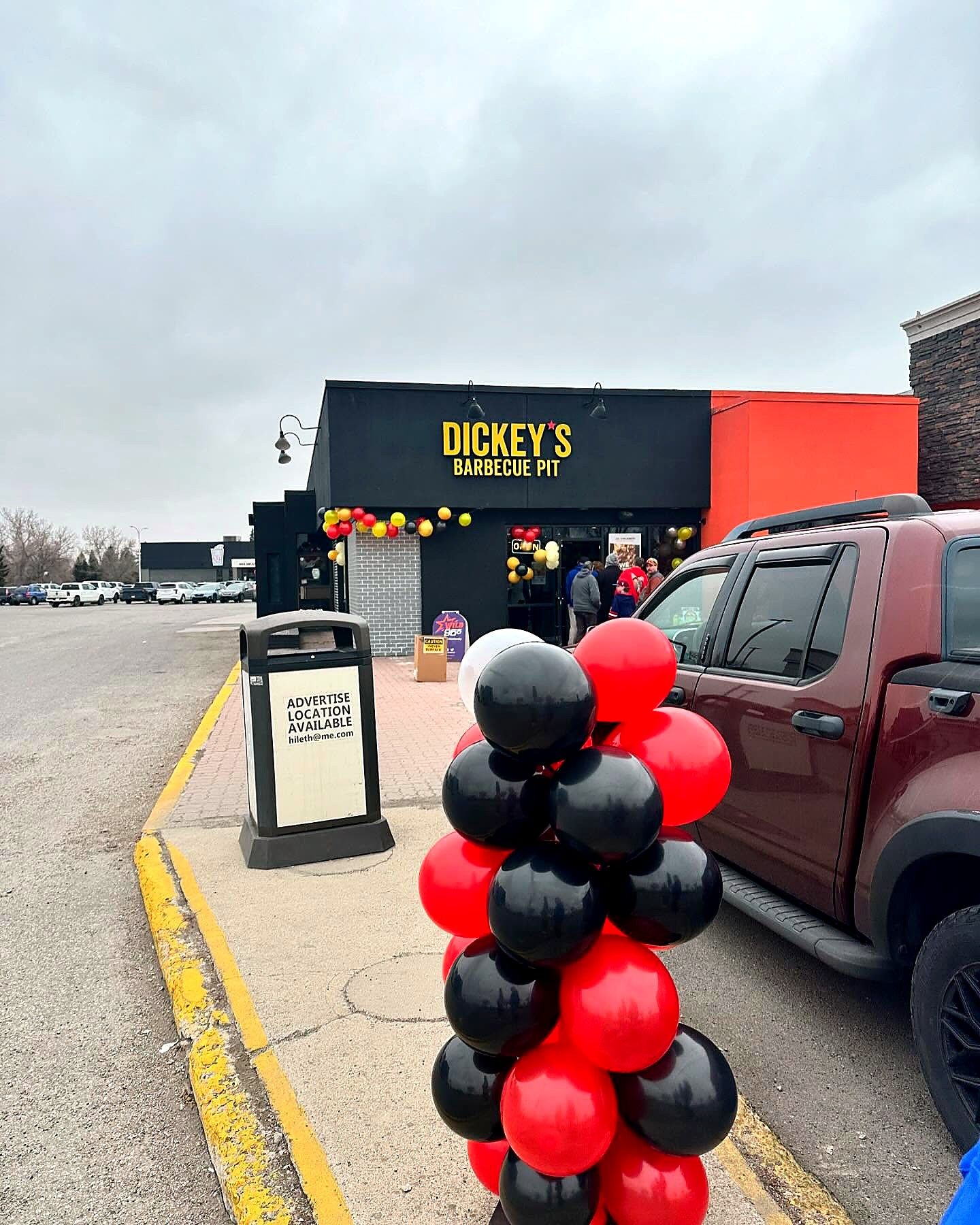 Dickey's Barbecue Pit storefront from the parking lot during the grand opening
