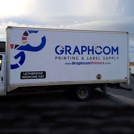 White box truck with Graphcom Printing & Label Supply graphics